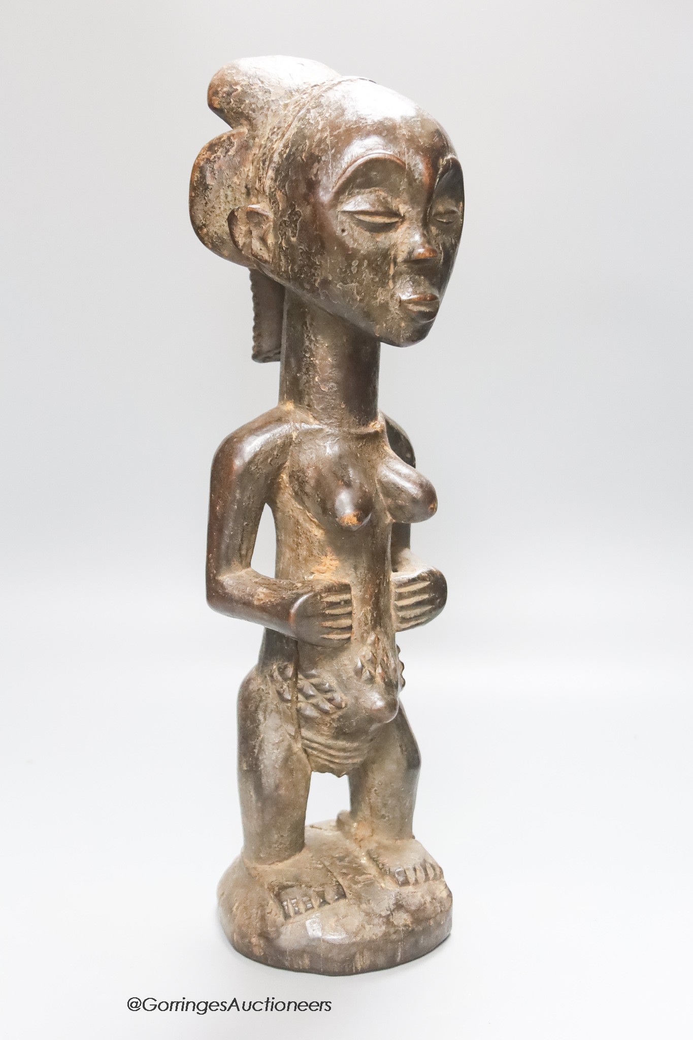 An African Luba tribal wood maternity figure, height 45cm